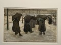 - Women carrying sacks of coal in the snow 